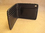Handmade Burgundy Stingray Bifold Wallet w/Black Kangaroo Lining, Billfold and Pockets.  Black Doe Kid Leather Hand Braided Edge.  Hand sewn credit card dividers (4).  9" x 3.5" (Inside View)